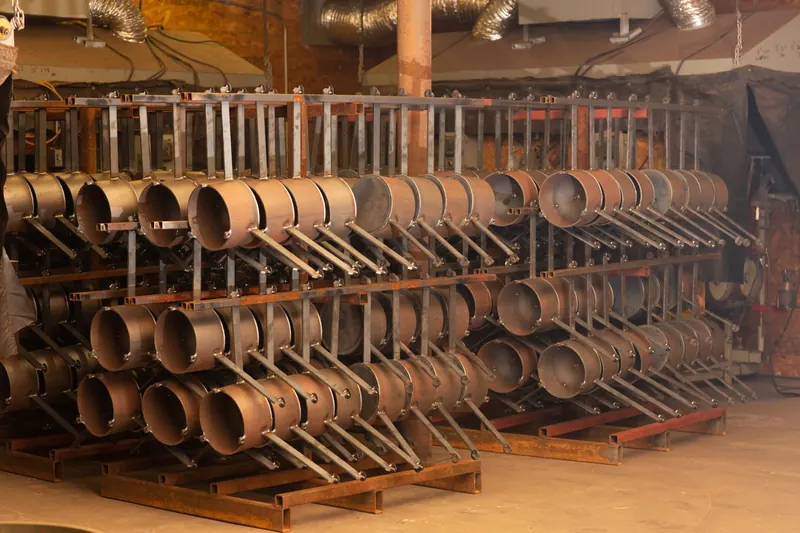 Racks of steel stand bowls waiting for paint