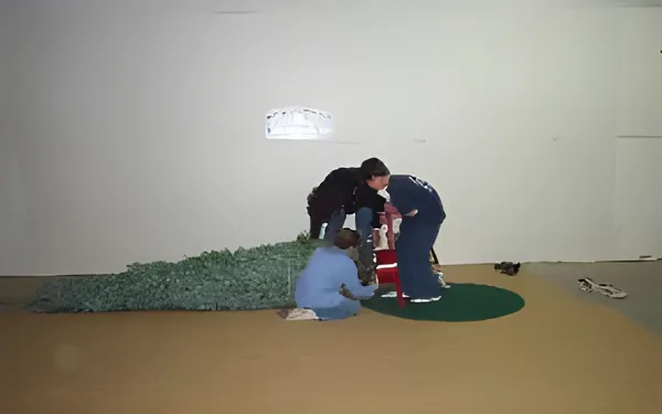 Children setting up a tree in the stand, step 4